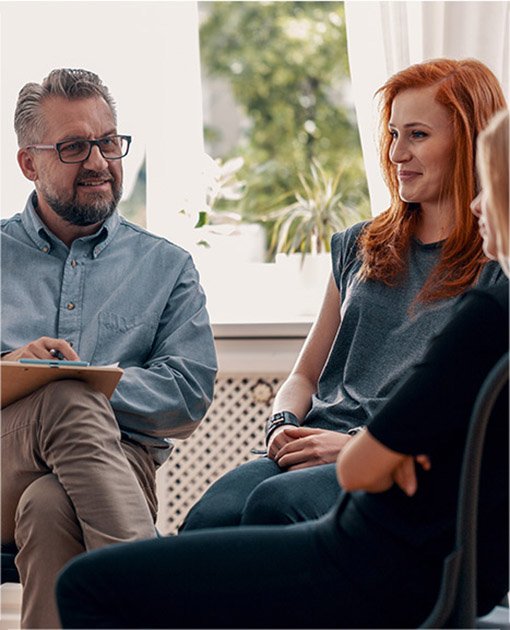 Male therapist with 2 young female clients