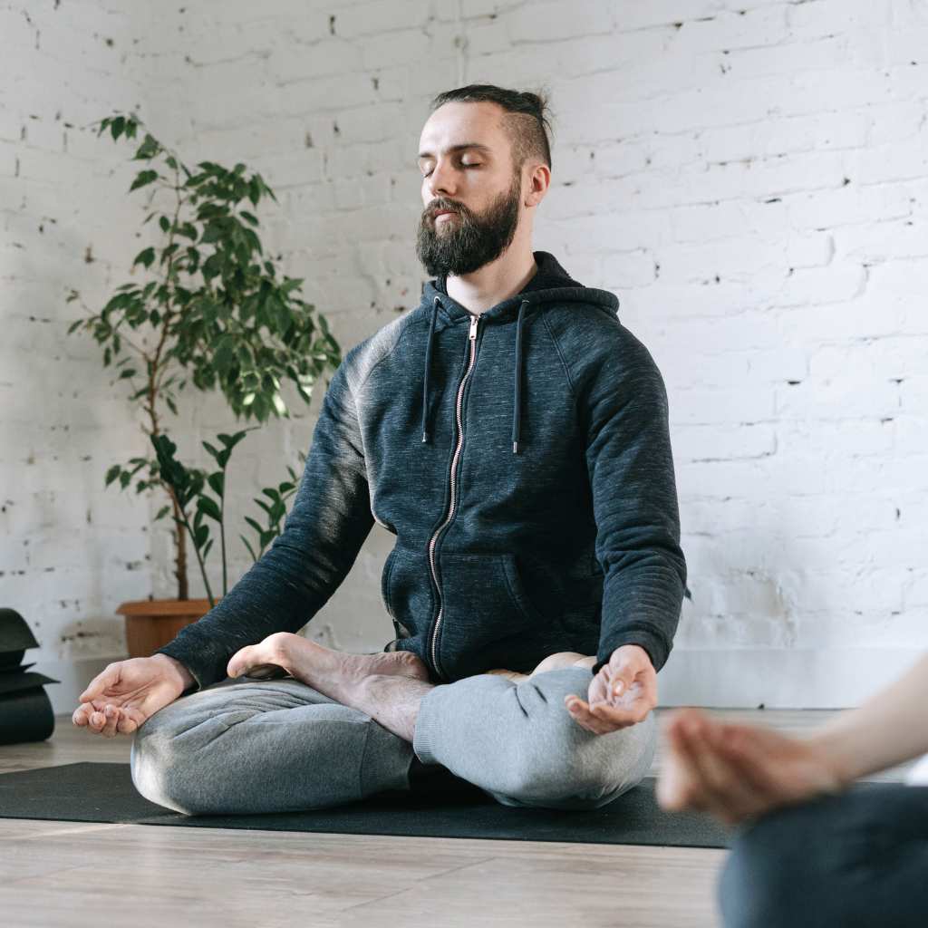 man practicing yoga